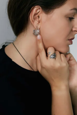lava Flow textured silver earrings - on ear